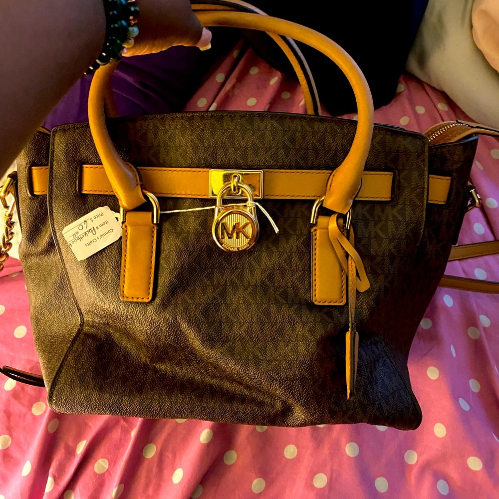 Brown Michael Kors bag.